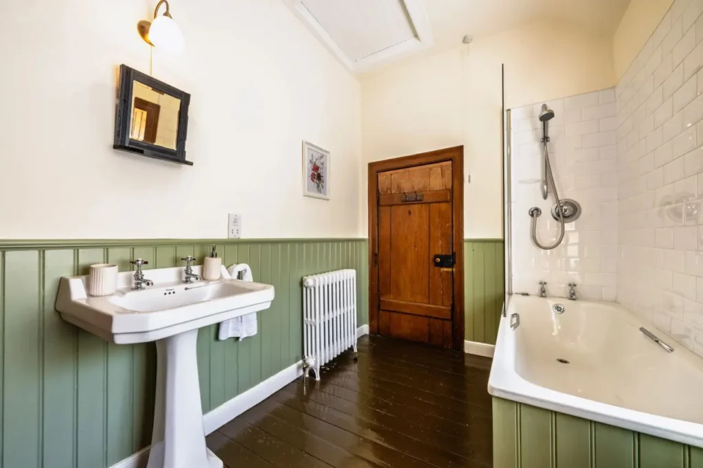 Elegant bathroom with vintage features.